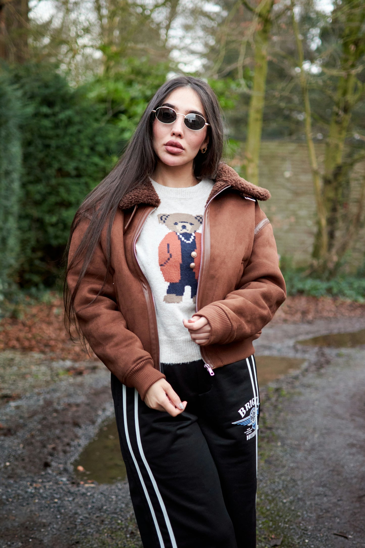 XAYWEAR brown winter jacket with shearling collar worn by woman outdoors in casual outfit