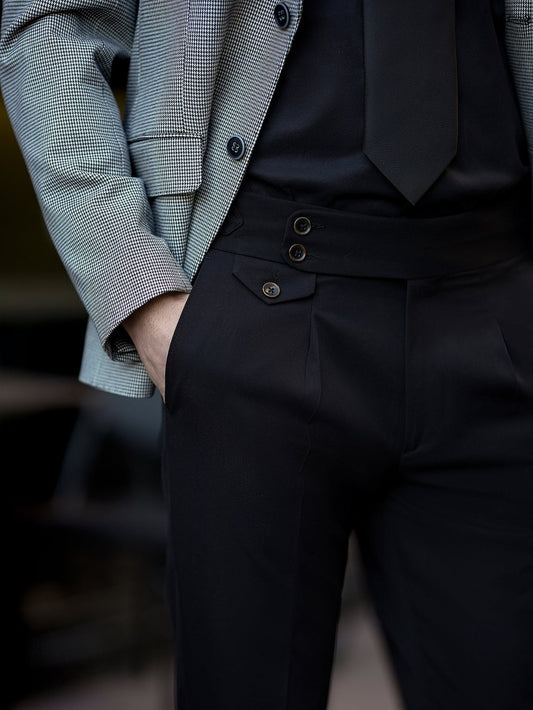 Close-up of XAYWEAR two piece suit for men with tailored black pants and checkered blazer