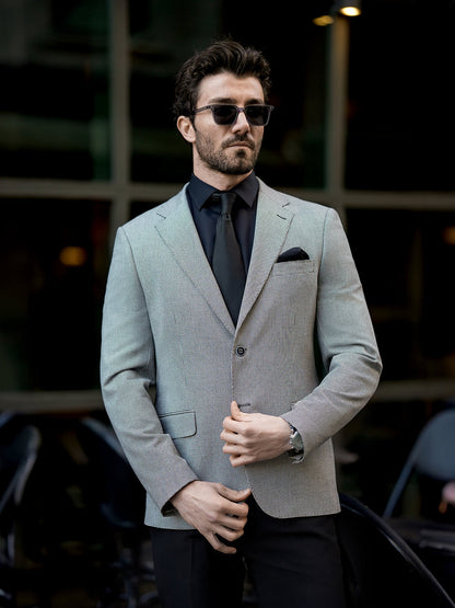 XAYWEAR two piece suit for men in light gray worn with black shirt and tie and sunglasses