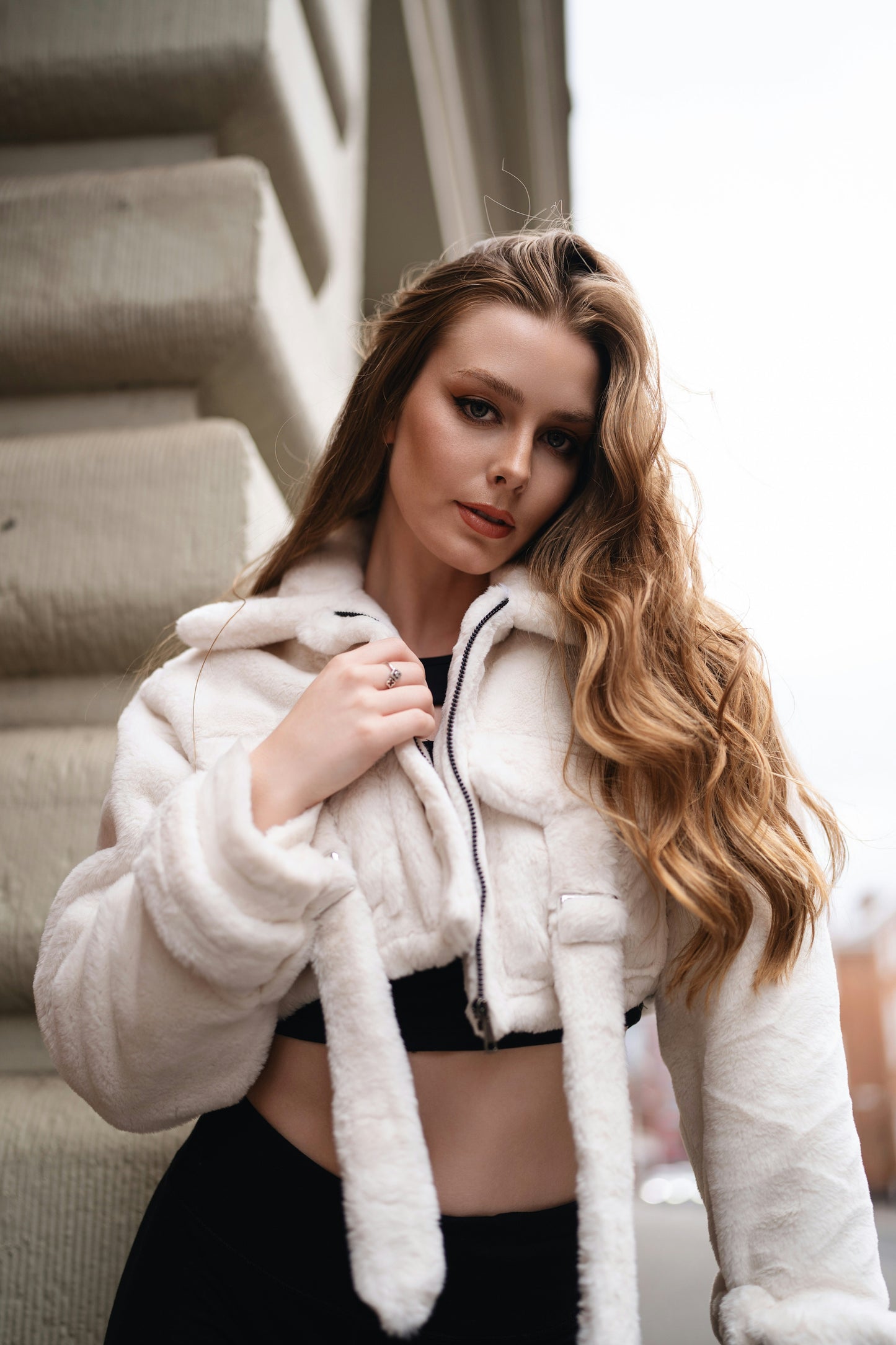 XAYWEAR ivory women jacket with hood and long sleeves worn by model posing outdoors