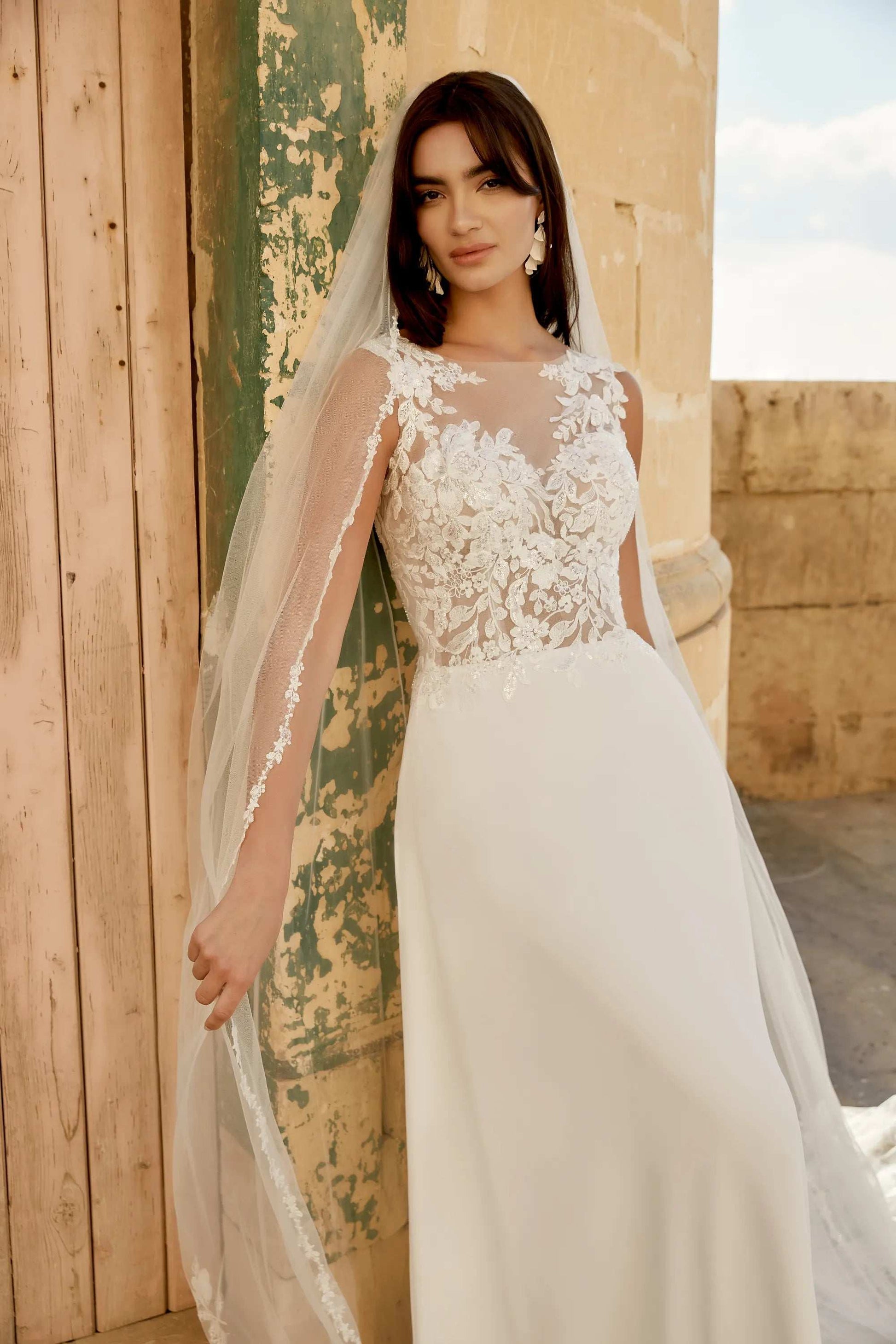 Elegant XAYWEAR lace bodice chiffon wedding dress with sheer long sleeves and a flowing train