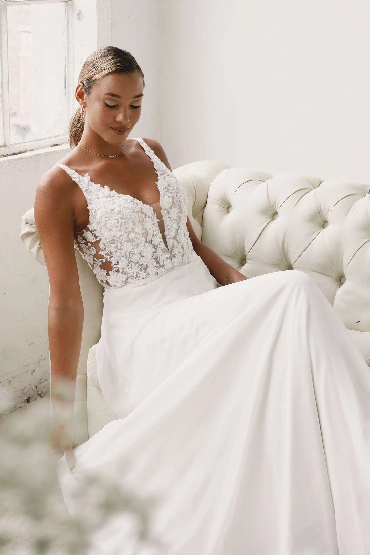 XAYWEAR lace bodice wedding dress with a romantic V-neck and flowing skirt for a timeless bridal look