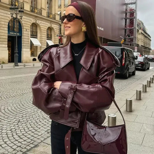 XAYWEAR burgundy women jacket leather bomber on woman with matching bag sunglasses and gold earrings on city street
