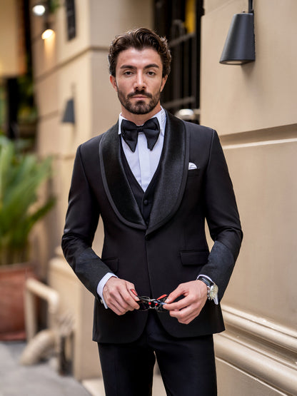 XAYWEAR elegant black three piece suit for men with satin lapels and bow tie worn by male model
