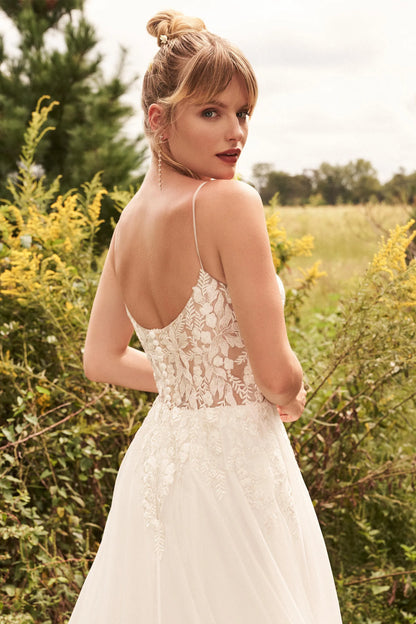 XAYWEAR luxury wedding dress featuring sheer lace back and delicate spaghetti straps in outdoor setting