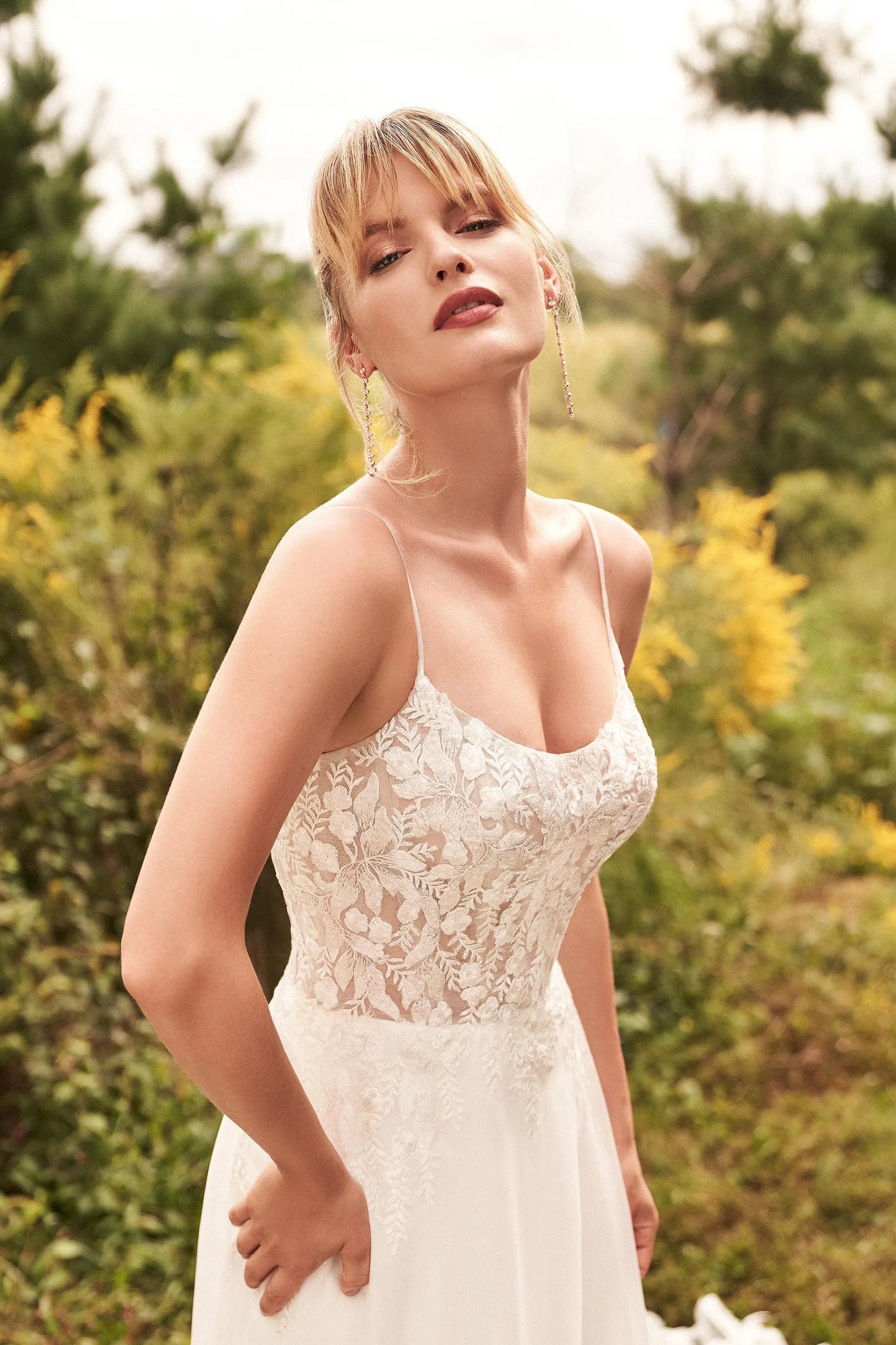 XAYWEAR luxury wedding dress with delicate lace bodice and flowing skirt worn outdoors