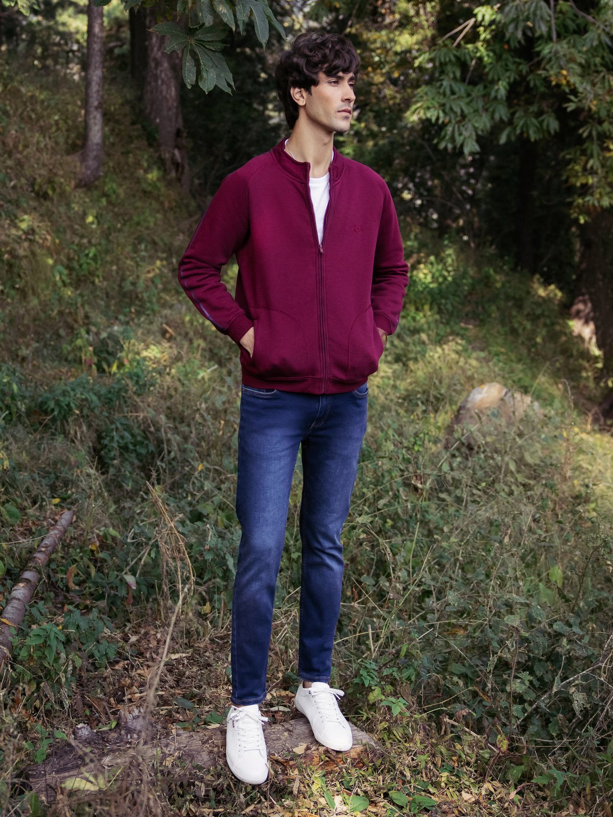 XAYWEAR men casual jacket in maroon worn outdoors with blue jeans and white sneakers