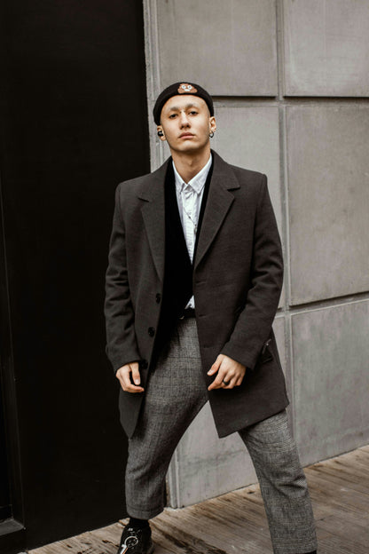 XAYWEAR stylish men coat in dark color worn with gray pants and white shirt