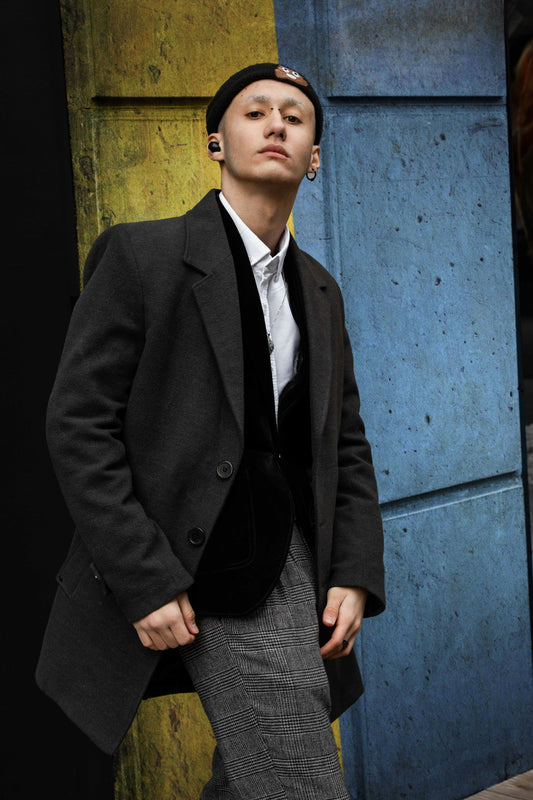 XAYWEAR stylish men coat in dark gray worn over black blazer and white shirt with patterned pants