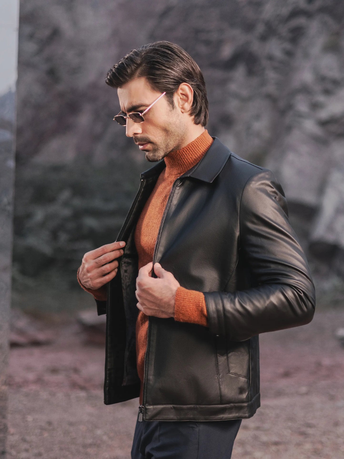 XAYWEAR men leather jacket black bomber jacket worn over orange sweater outdoors