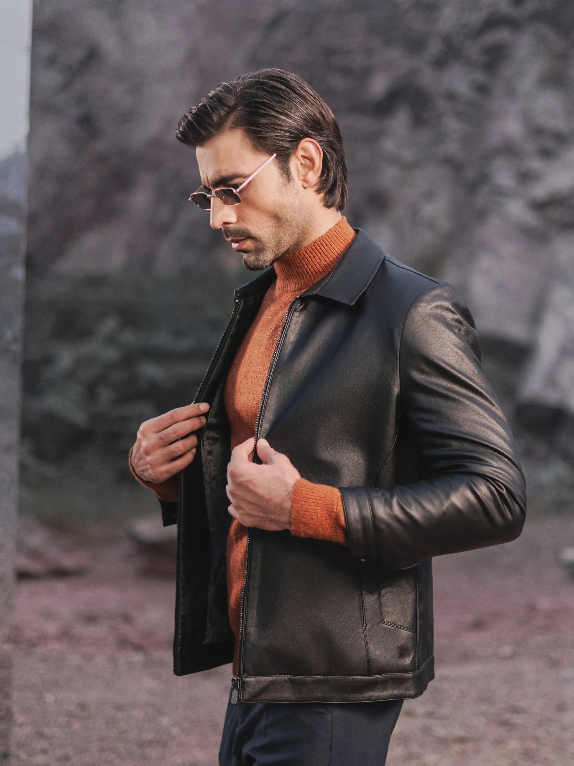 XAYWEAR men leather jacket black bomber jacket worn over orange sweater outdoors