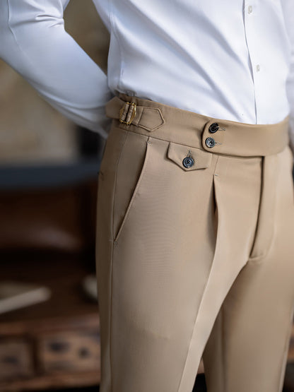 Close-up of beige suit pants from a suit for men by XAYWEAR paired with a white dress shirt