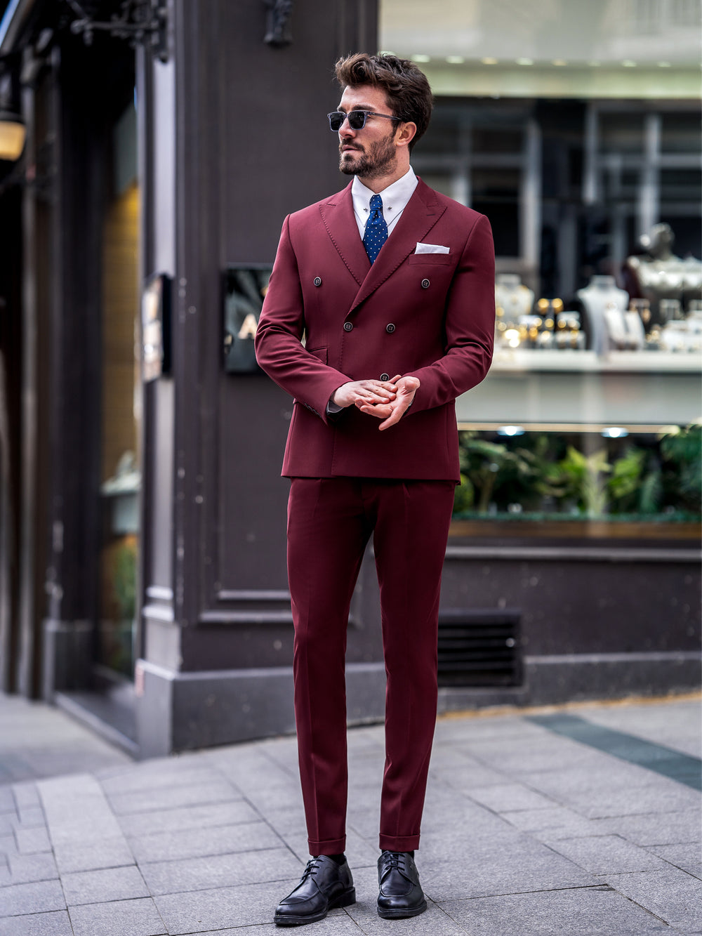 XAYWEAR burgundy men suit with double-breasted blazer and slim fit pants worn with black shoes