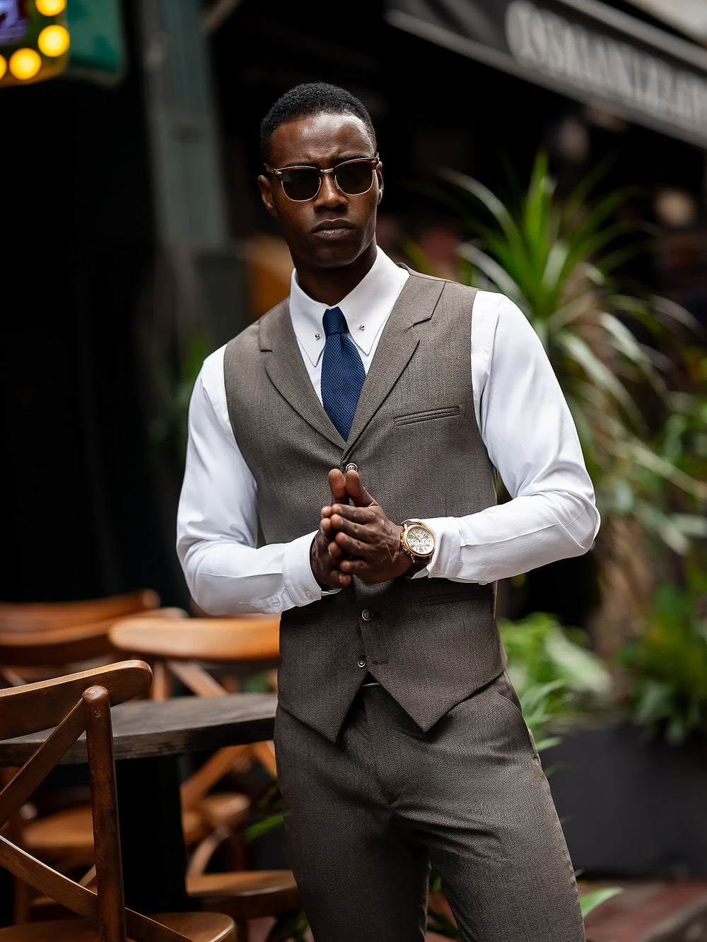 Stylish men suit by XAYWEAR featuring a gray vest and pants with white shirt and blue tie