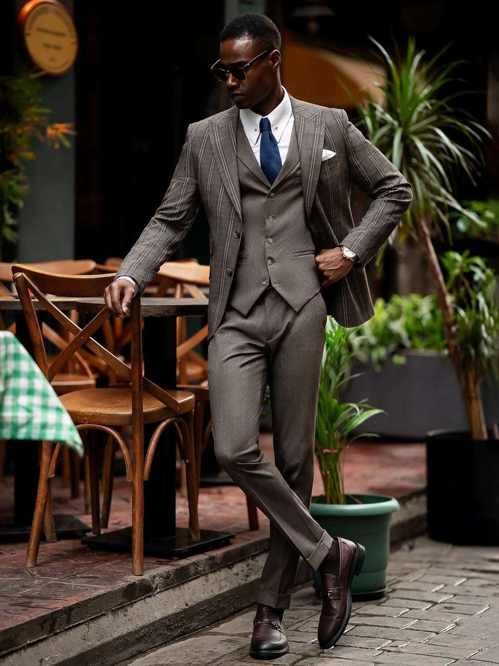 Stylish XAYWEAR men suit with striped blazer, matching vest and pants, paired with blue tie and dress shoes