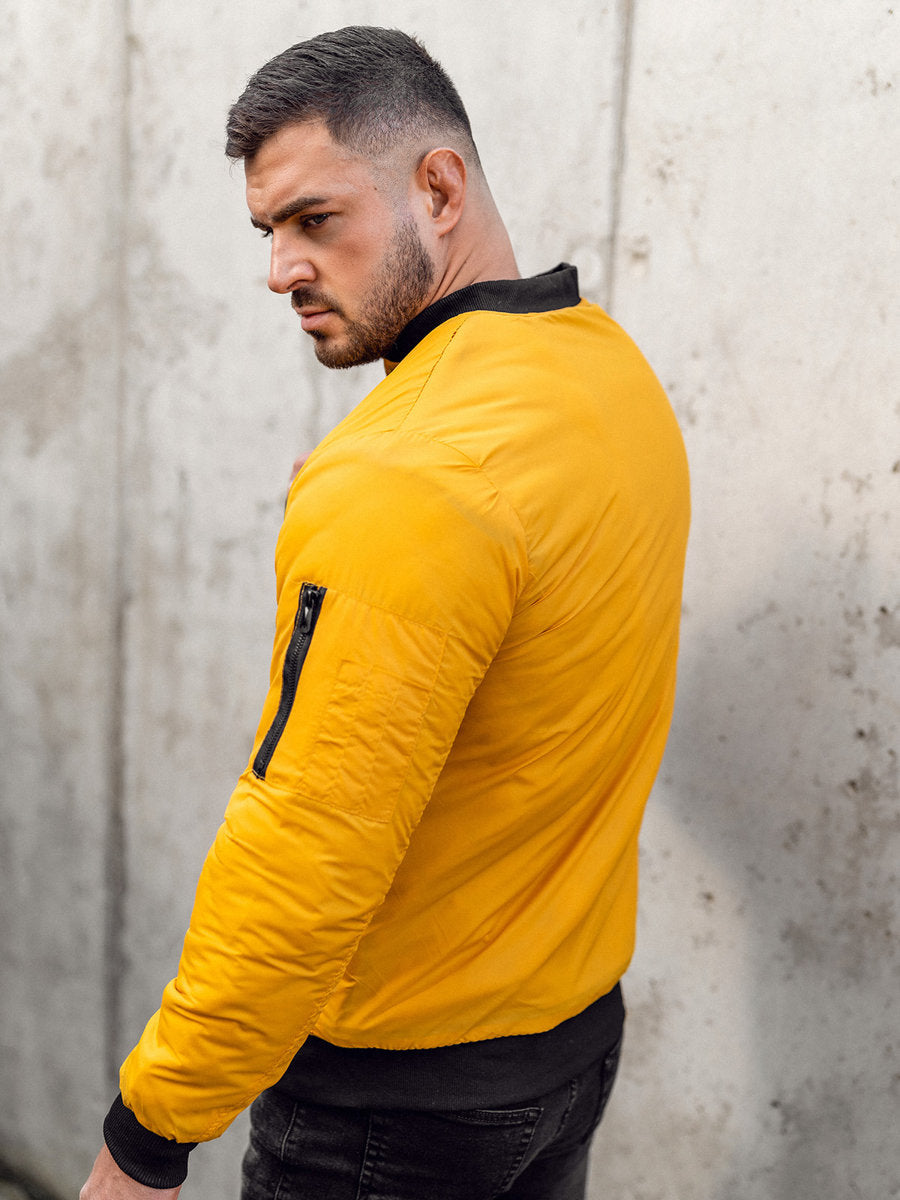 XAYWEAR men yellow jacket bomber style with black collar and sleeve zipper on man posing sideways