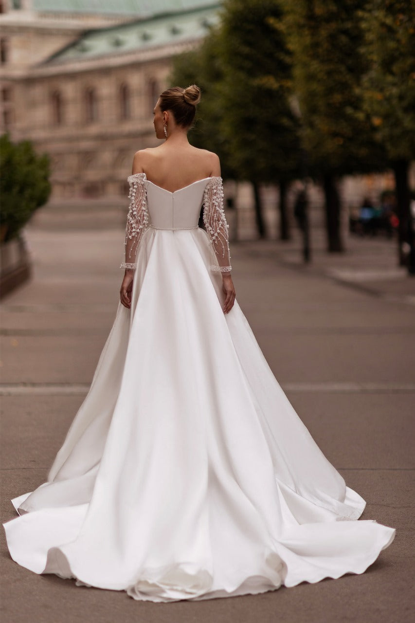 XAYWEAR elegant off shoulder wedding dress with long sheer embellished sleeves and flowing train