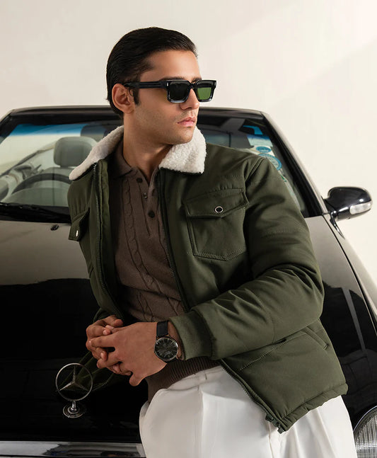 Olive winter jacket for men styled with sunglasses, perfect for a chic winter look