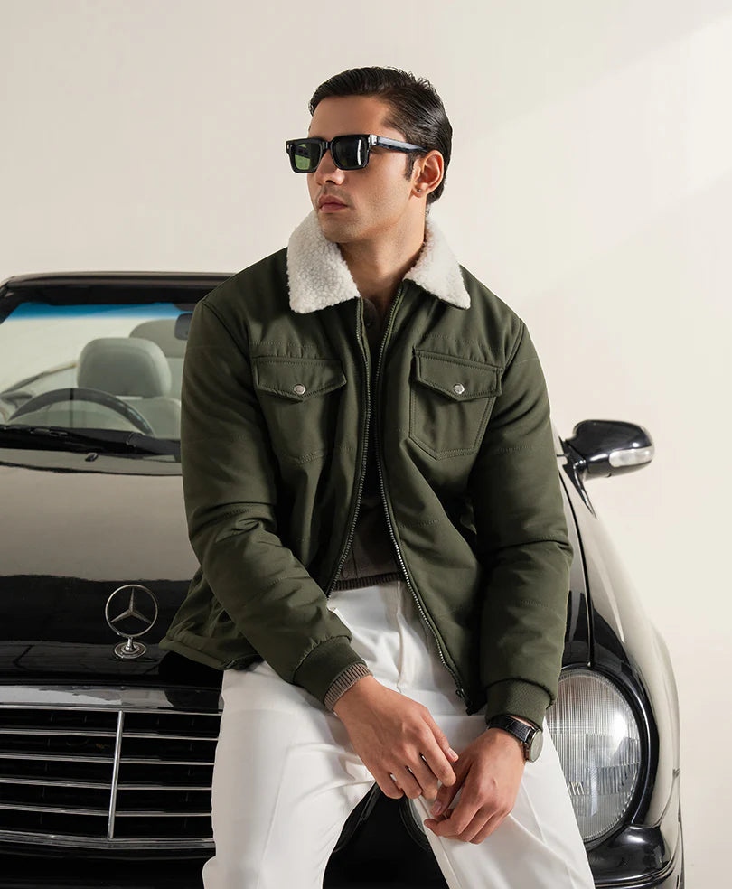 XAYWEAR olive winter jacket for men with a shearling collar, styled casually with sunglasses