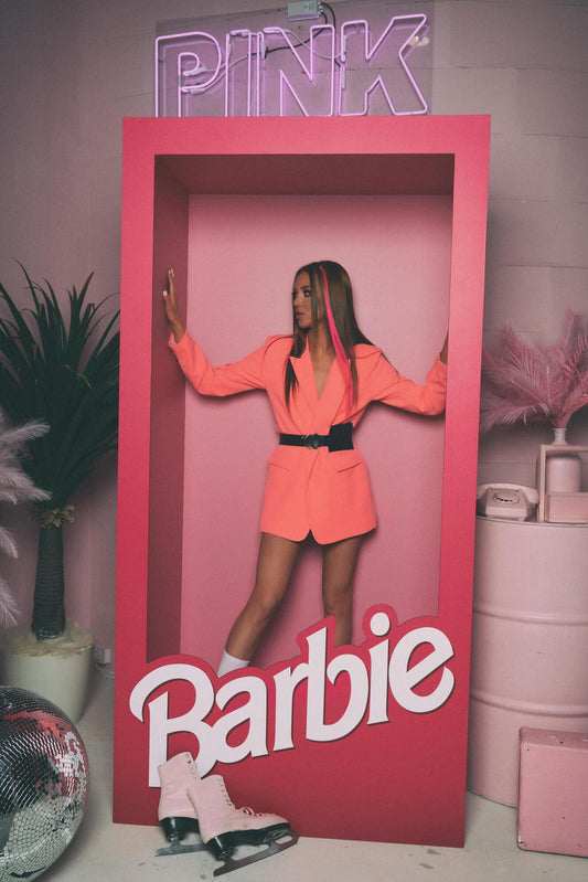 XAYWEAR pink jacket for women styled as a blazer worn by model in Barbie-themed photo frame