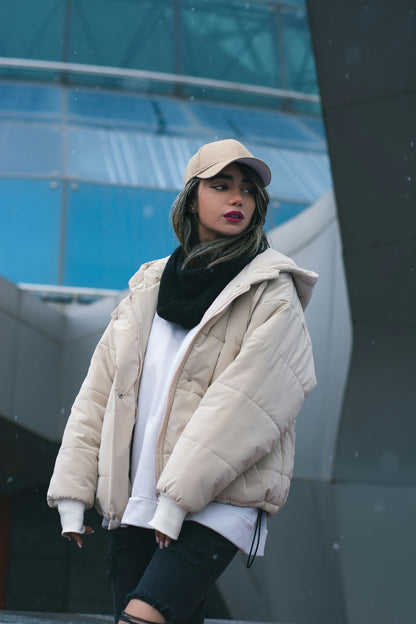 XAYWEAR beige puffer jacket for women with hood, worn with black scarf and beige cap