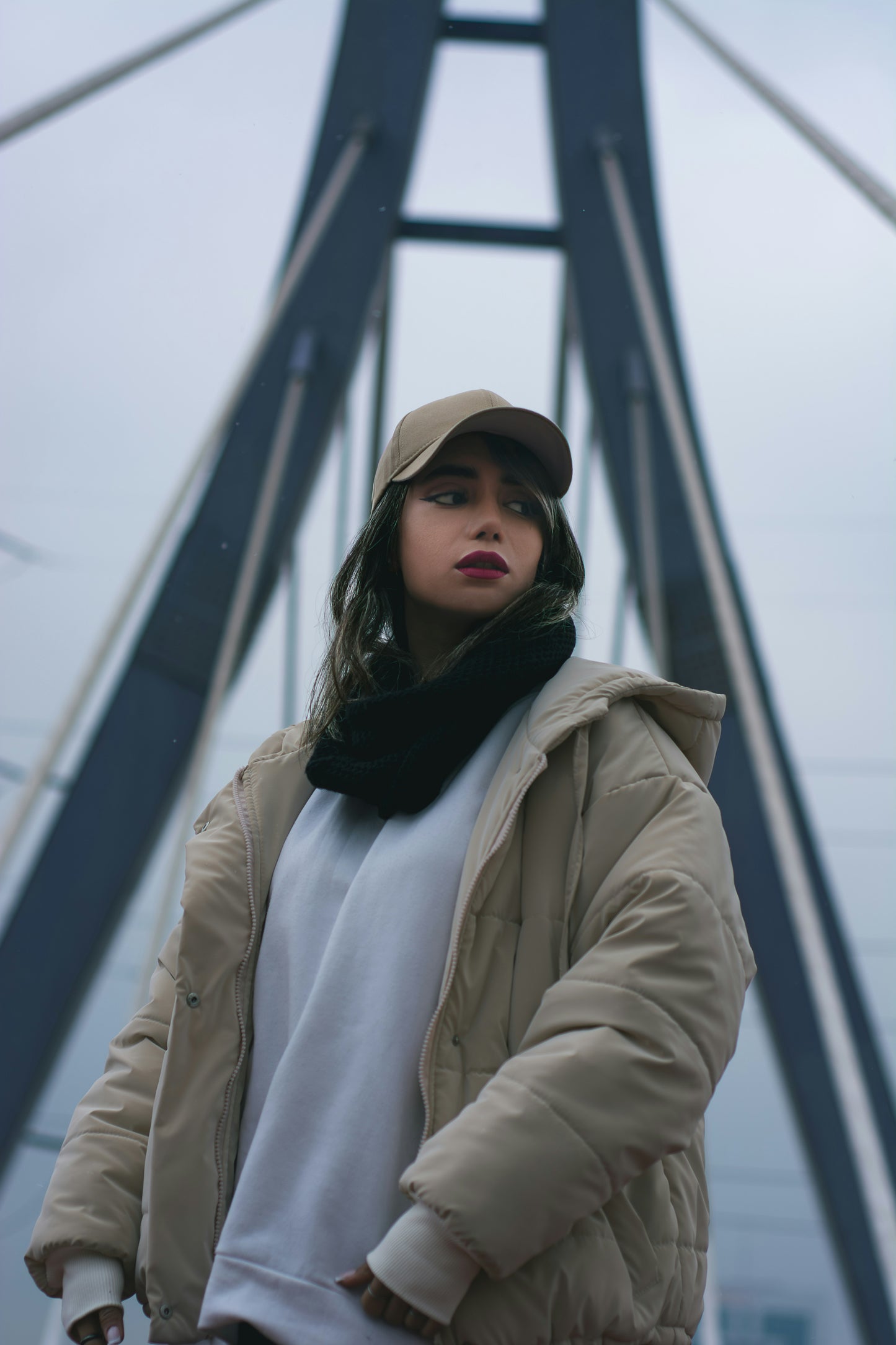 XAYWEAR beige puffer jacket for women worn outdoors with hood and oversized fit