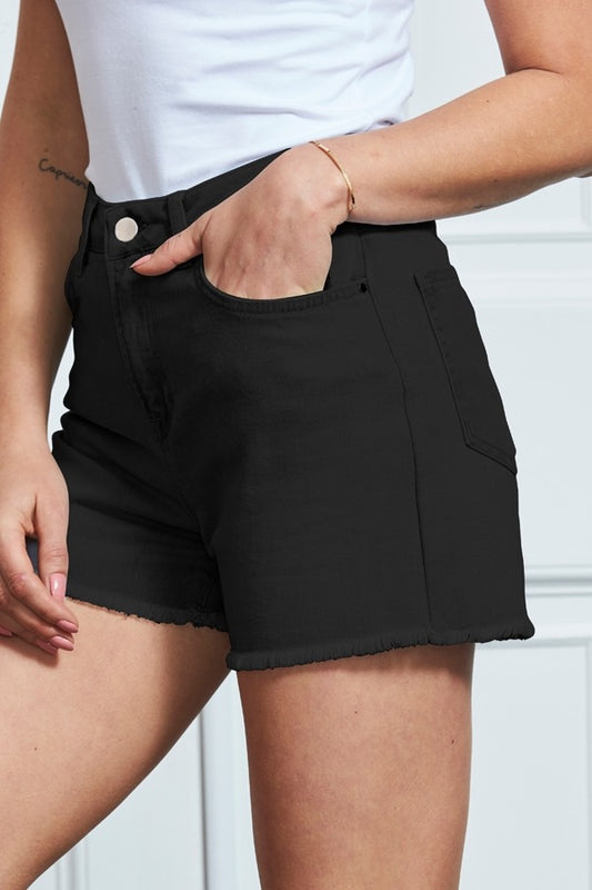 XAYWEAR black casual shorts for women with front and back pockets and raw hem detailing