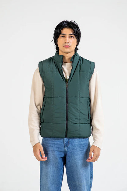 XAYWEAR sleeveless puffer jacket in green, offering lightweight warmth and stylish versatility