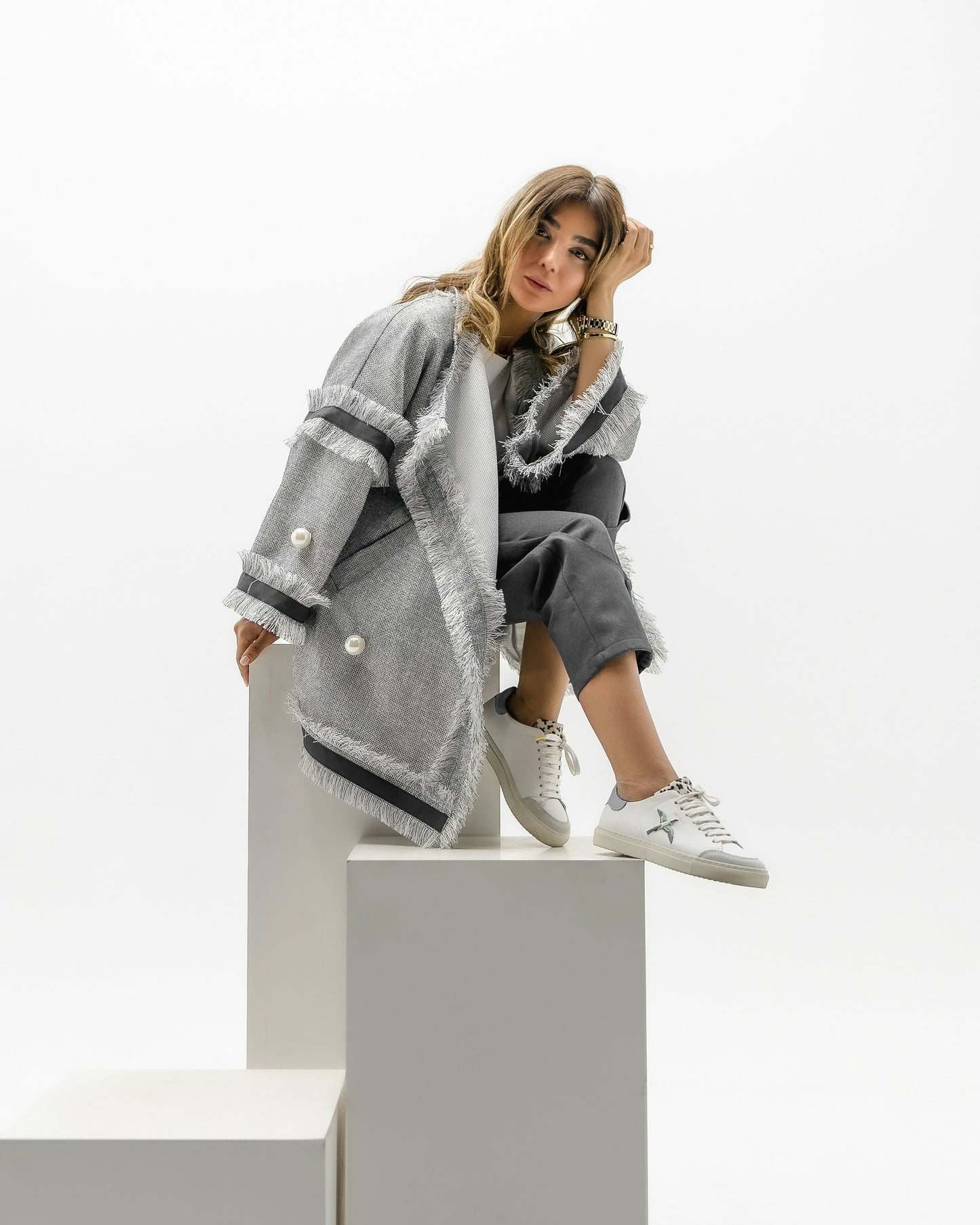 XAYWEAR women coat in gray with fringe details styled with casual pants and white sneakers