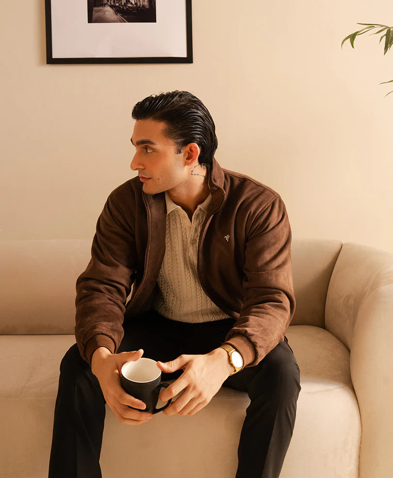 Stylish brown suede jacket for men, perfect for casual wear with cozy outfit on a sofa