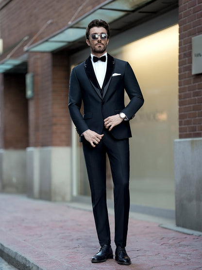 XAYWEAR black formal three piece suit with bow tie worn by a man standing outdoors