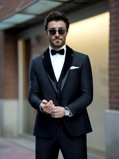 XAYWEAR stylish black three piece suit with bow tie and sunglasses on man outdoors