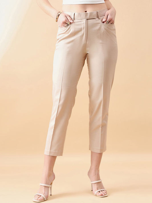 XAYWEAR beige cropped trousers for women with belt loops and front pockets styled with white sandals