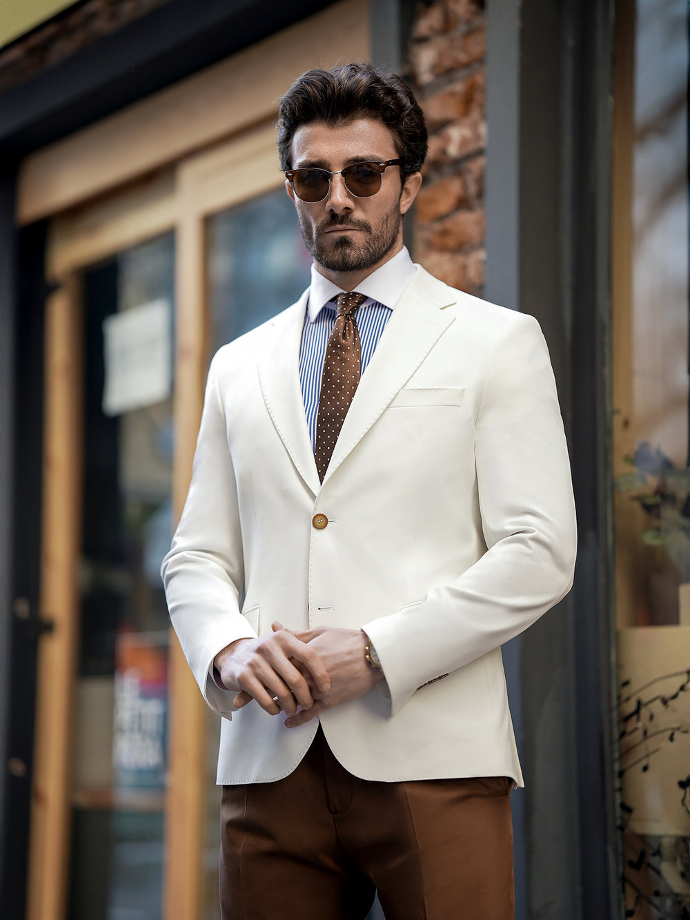 XAYWEAR stylish two piece suit for men with white blazer and brown pants worn with tie and sunglasses