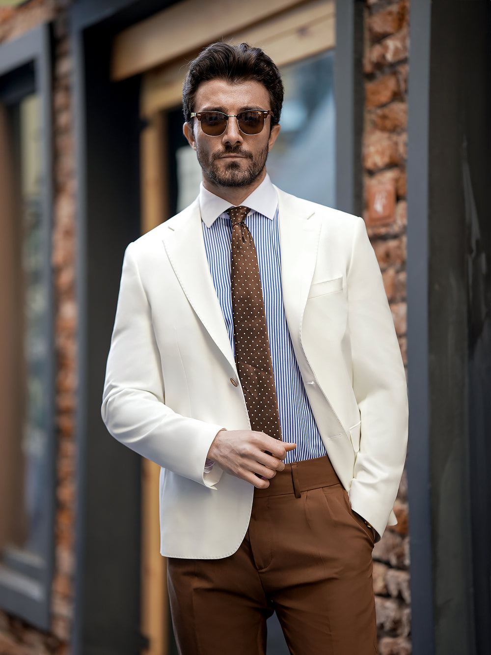 XAYWEAR two piece suit for men featuring white blazer and brown pants styled with striped shirt and tie