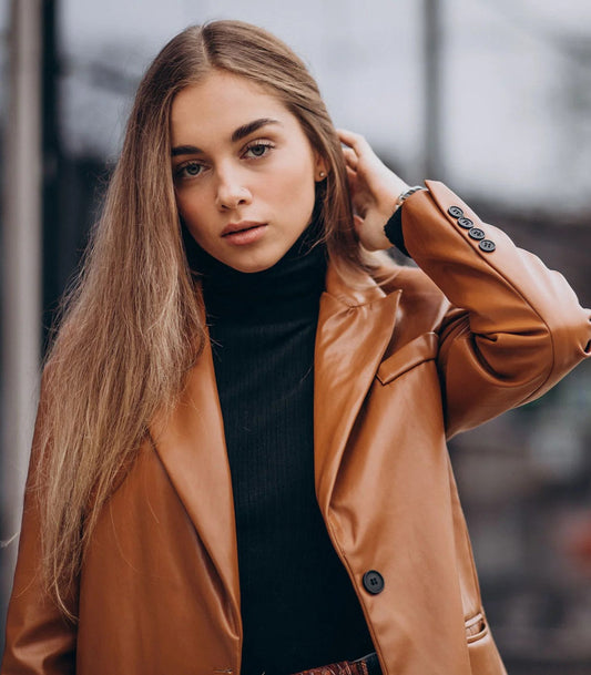 XAYWEAR faux leather jacket for women in brown worn over black turtleneck sweater