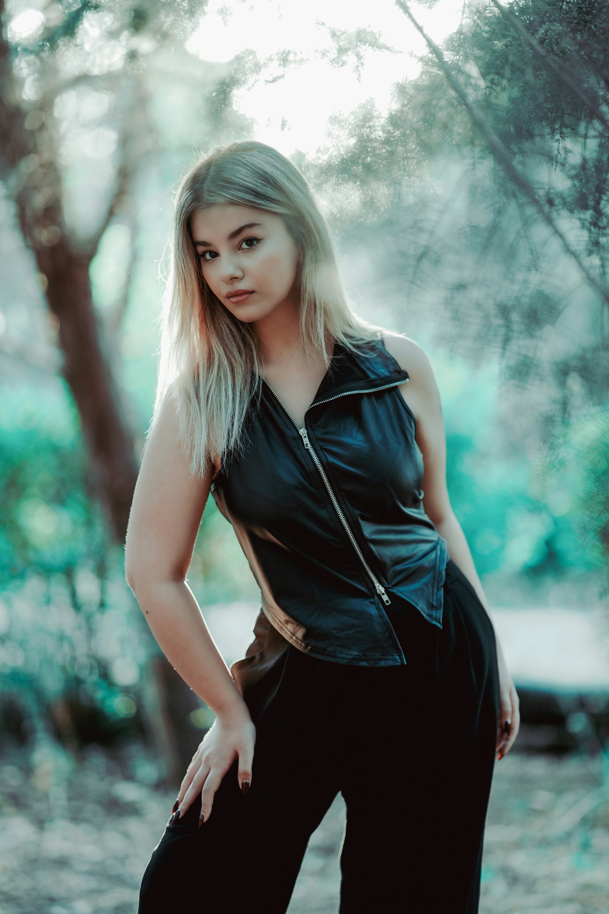 XAYWEAR black leather vest for women styled with zipper front and sleeveless design