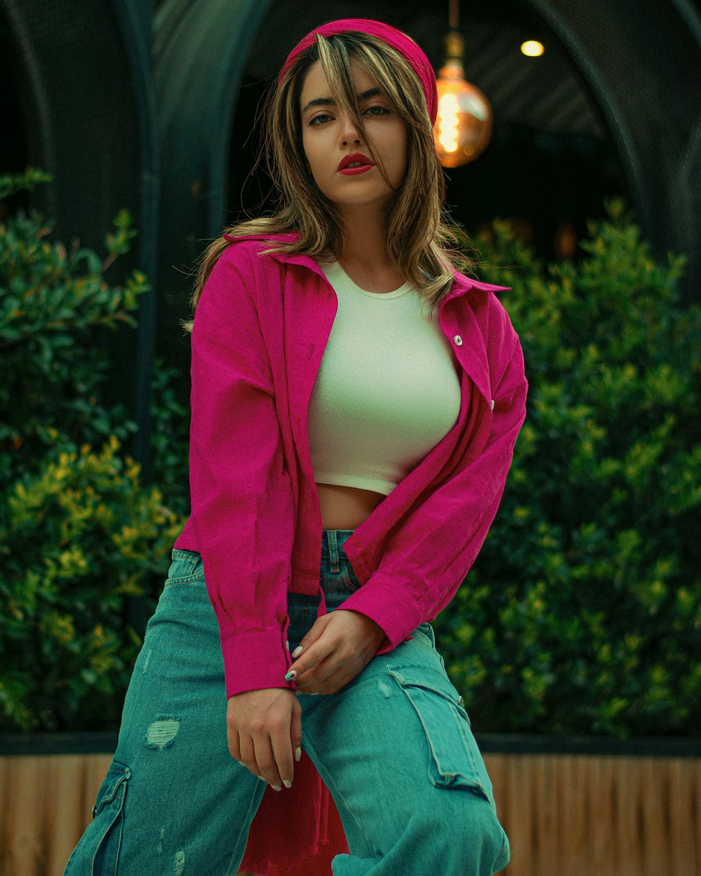 XAYWEAR pink jacket for women styled with casual jeans and a white crop top outdoors