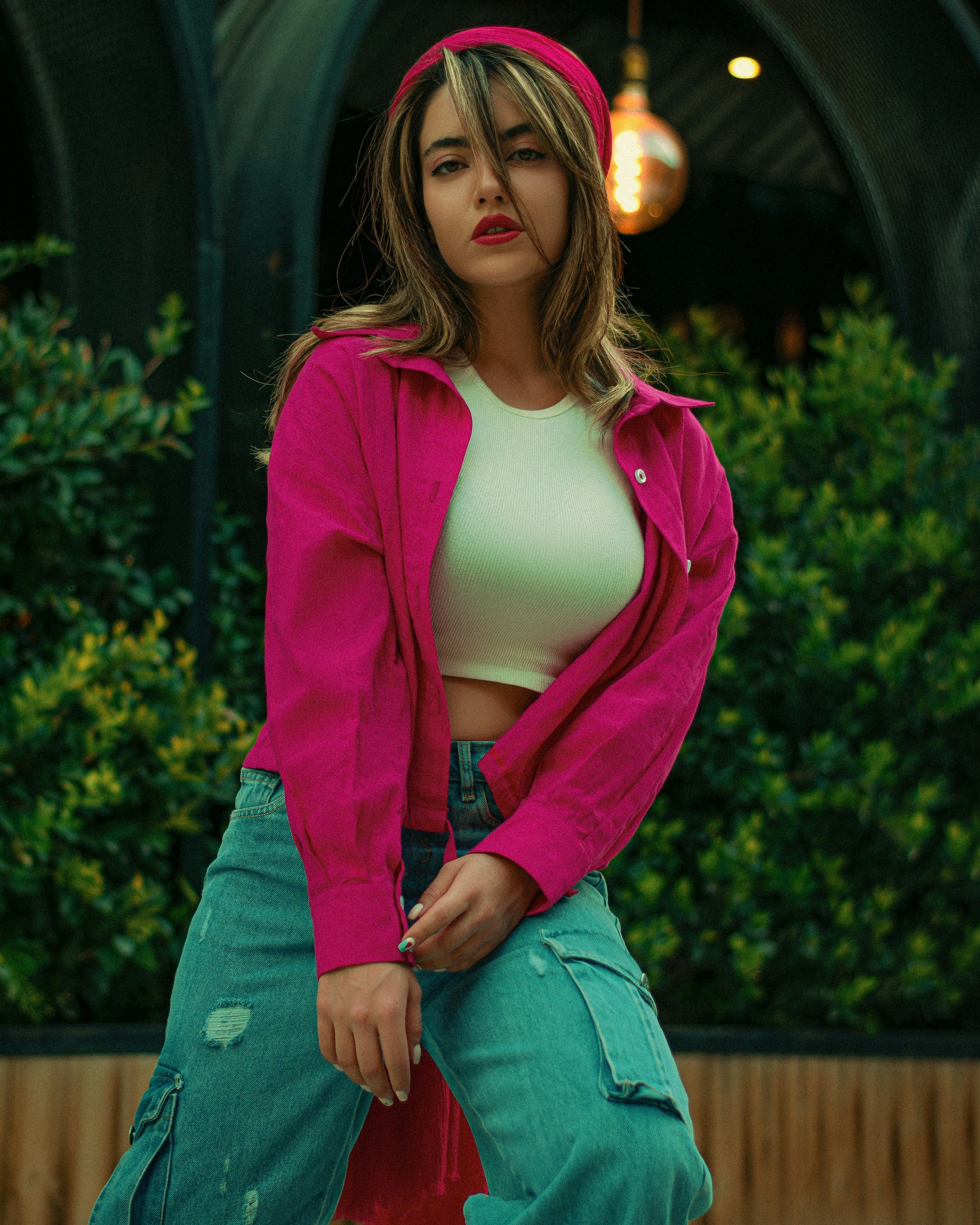 XAYWEAR pink jacket for women styled with casual green cargo pants and white crop top