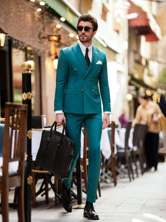 XAYWEAR teal double-breasted suit for men styled with black shoes and briefcase outdoors