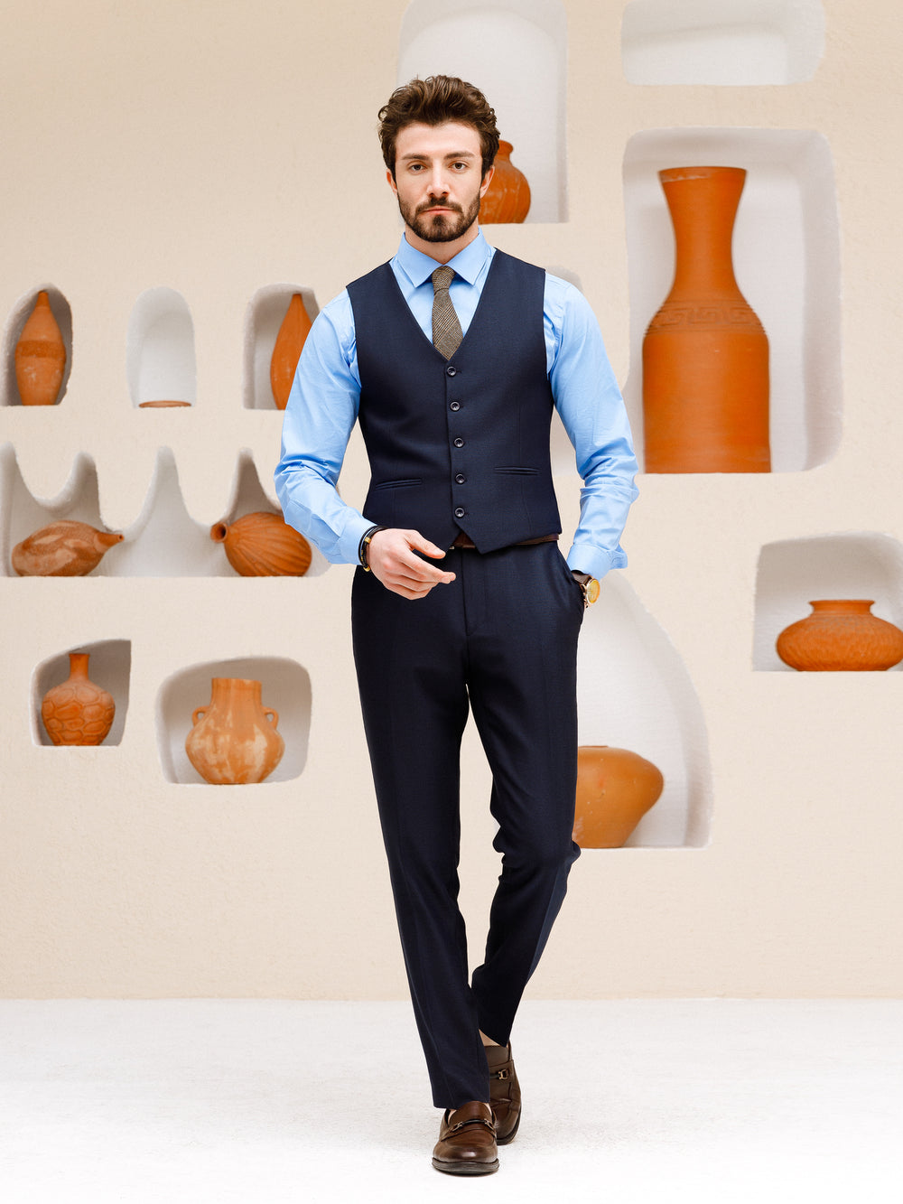 XAYWEAR suit set for men featuring a navy vest and pants paired with a light blue dress shirt