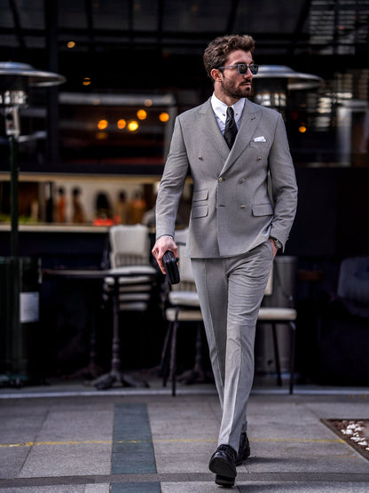 Stylish gray double-breasted suit for men by XAYWEAR worn with black dress shoes and sunglasses