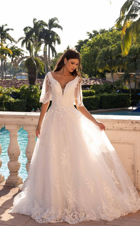XAYWEAR elegant wedding dress with lace sleeves and floral embroidery on flowing skirt