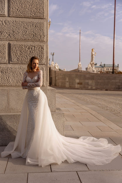 XAYWEAR elegant wedding dress with lace bodice and long flowing train worn outdoors