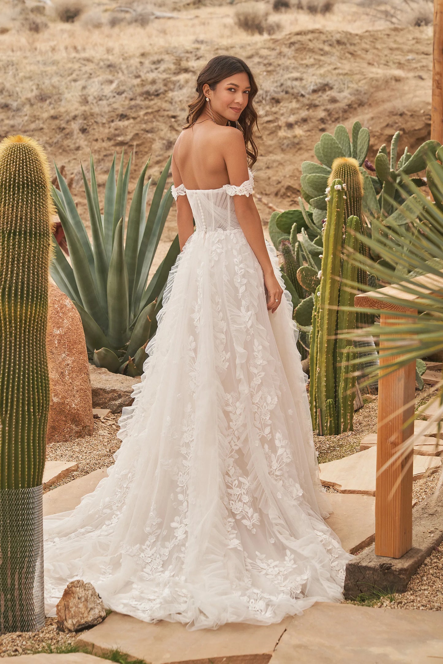 XAYWEAR off-shoulder wedding dress gown with floral lace details and long train shown outdoors