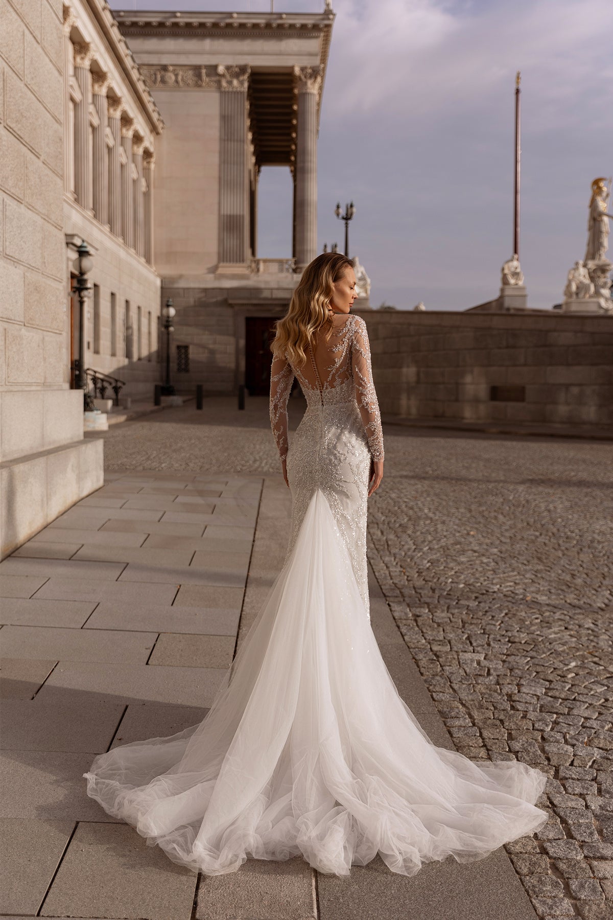 XAYWEAR elegant wedding dress gown with long lace sleeves and flowing tulle train outdoors
