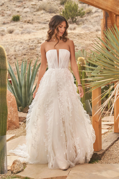 XAYWEAR strapless gown wedding dress with floral appliques and flowing skirt outdoors
