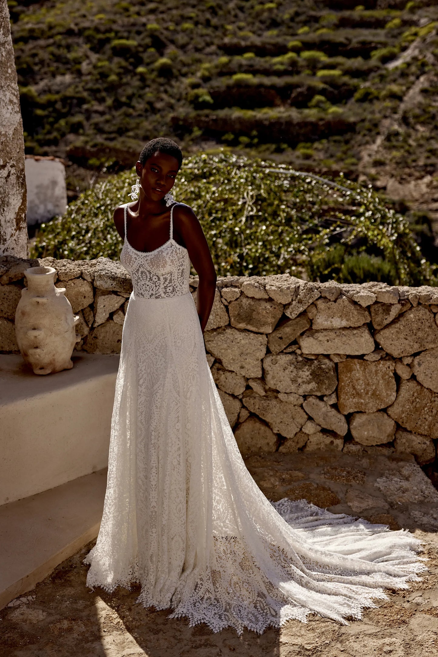 XAYWEAR elegant lace wedding gown with spaghetti straps and long train outdoors