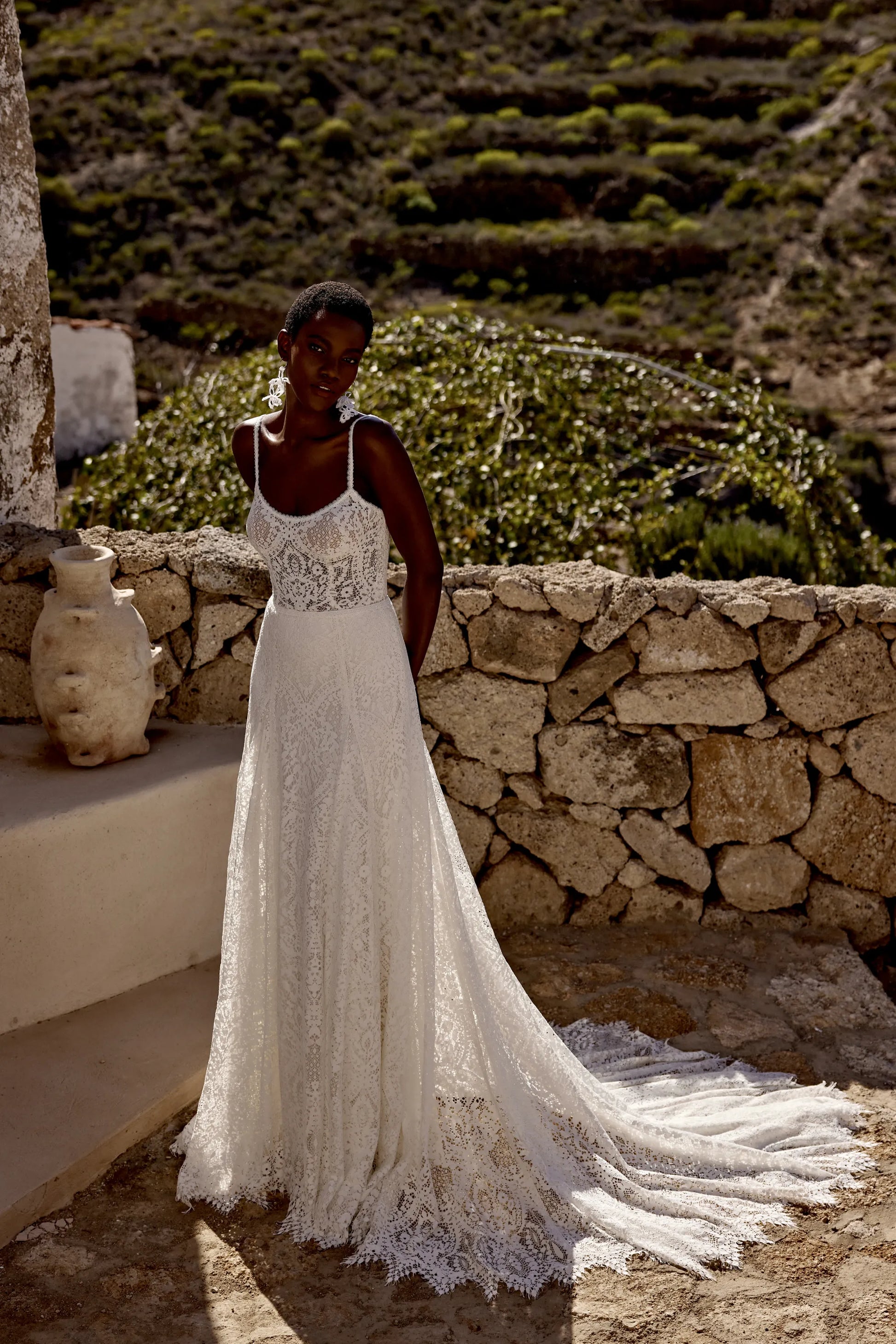 XAYWEAR elegant lace wedding gown with spaghetti straps and long train outdoors
