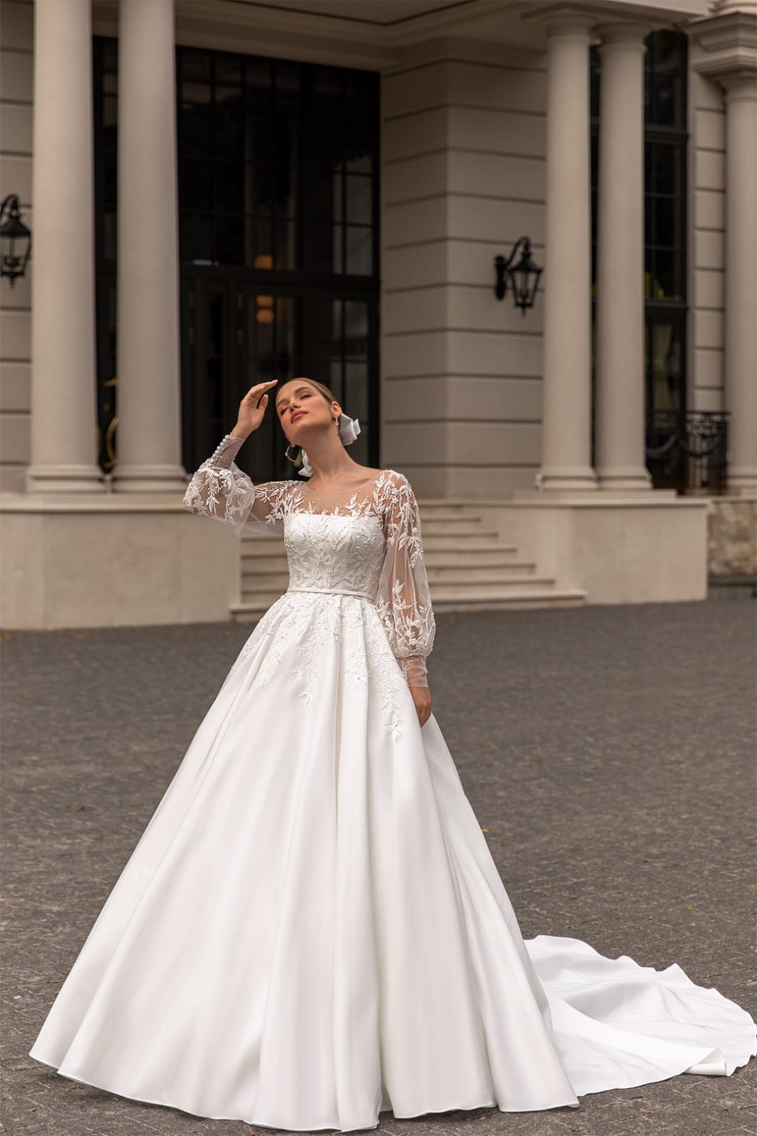 XAYWEAR elegant wedding gown with lace sleeves and full skirt with train in outdoor setting